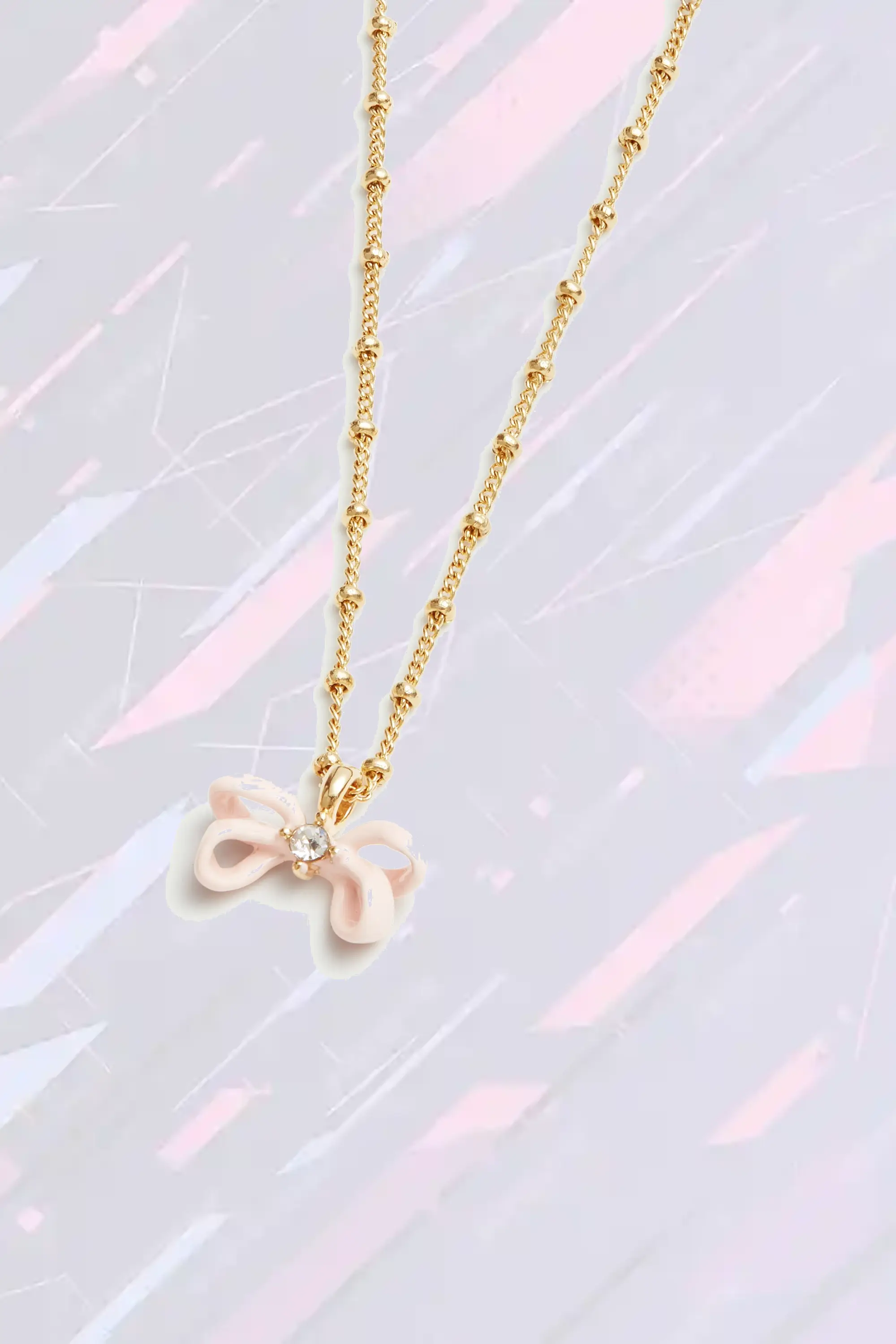 Bracelet Les Néréides avec pendentif ruban fleuri en tonalité poudrée